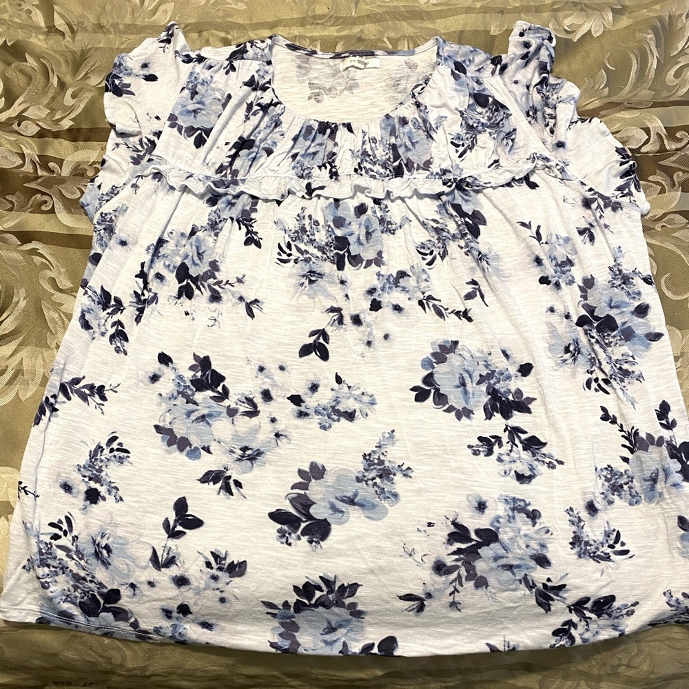 Beautiful crisp white blouse with blue flowers.